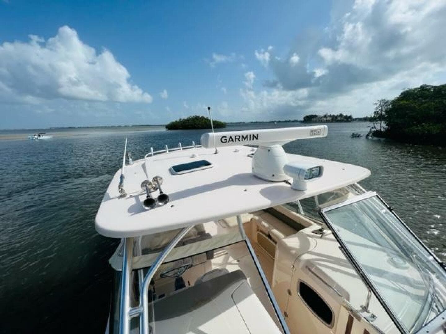 2014 Grady-White Freedom 335 boat with Garmin radar on calm waters.