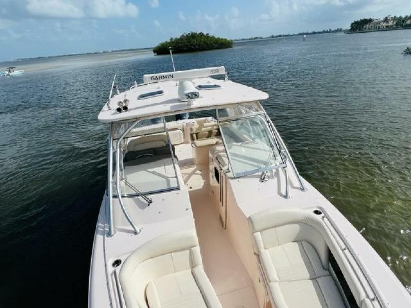 2014 Grady-White Freedom 335 boat on calm waters with island in background.