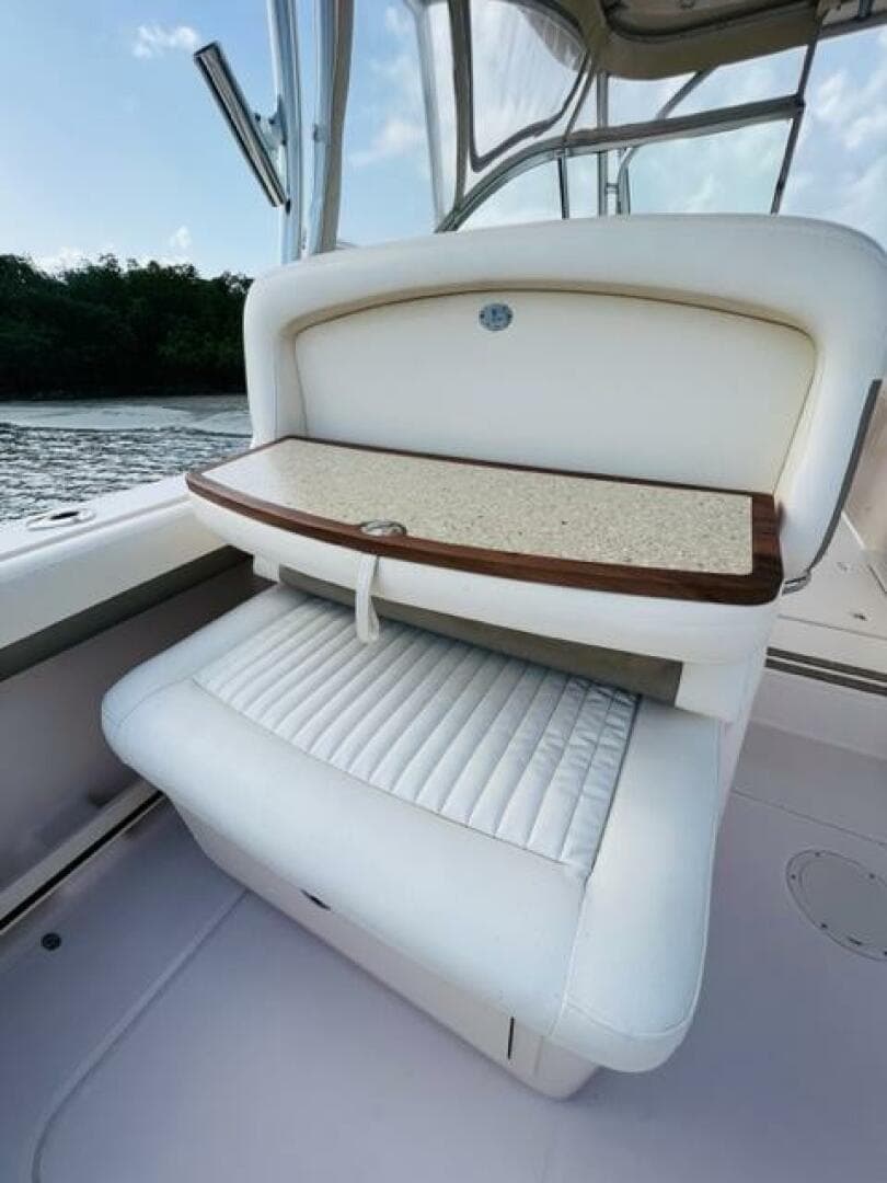 2014 Grady-White Freedom 335 boat interior seating with foldable table.