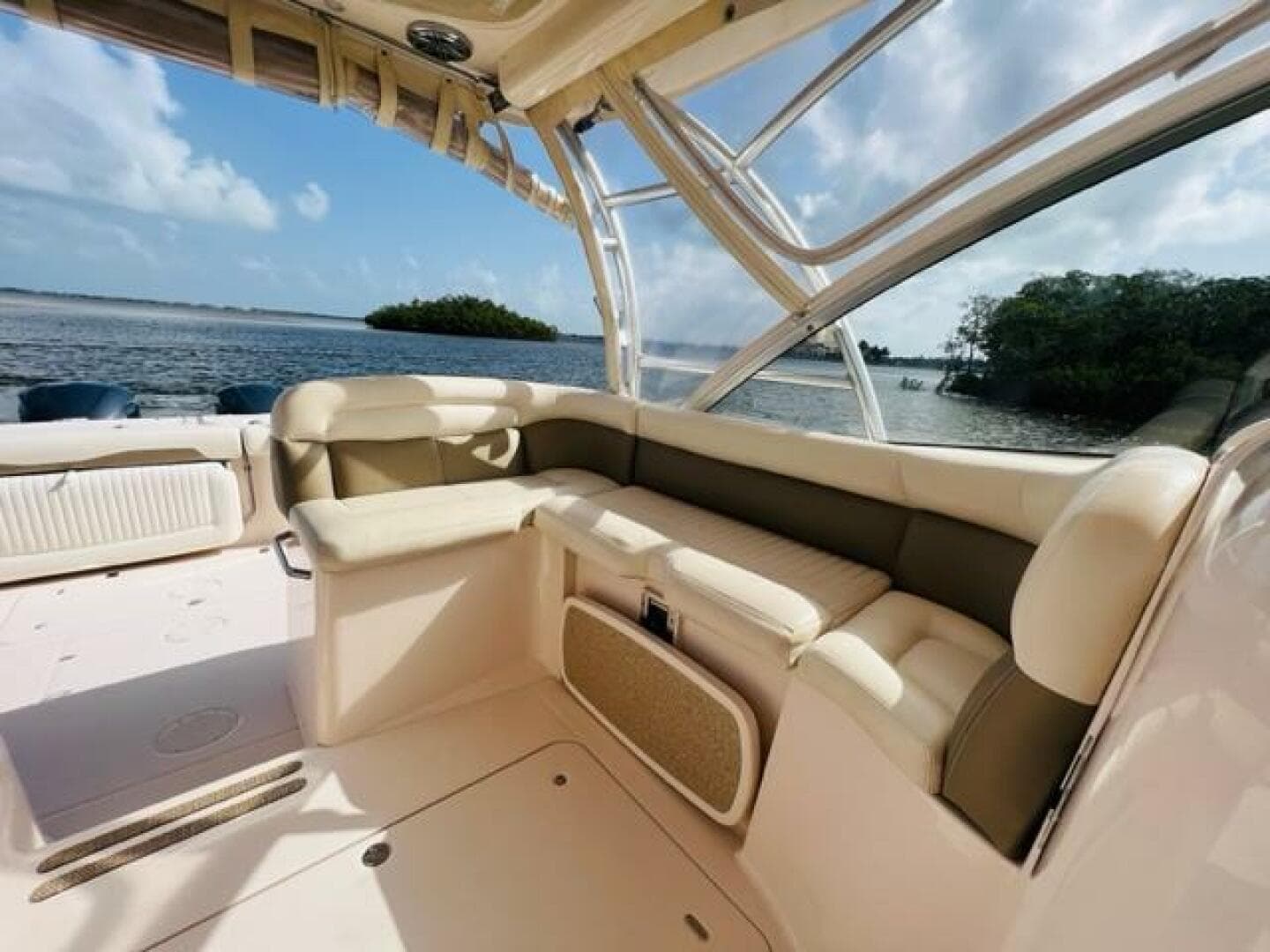 2014 Grady-White Freedom 335 boat interior with cushioned seating, ocean view in background.