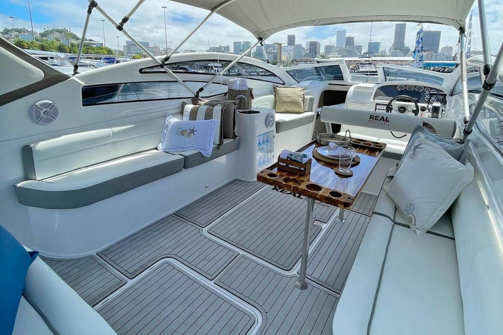 Luxurious 2023 Real 35 Special Deck (SD) yacht interior with city skyline view.