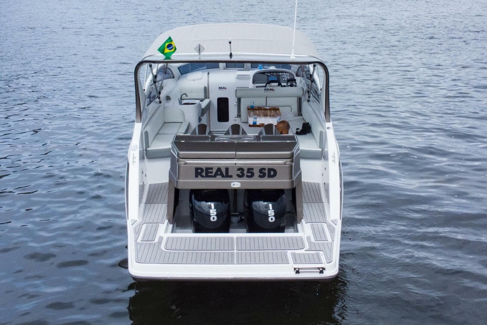 2023 Real 35 Special Deck (SD) boat on water, rear view.
