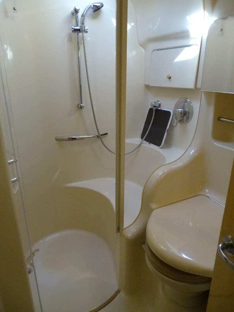 2001 Sea Ray 410 Sundancer bathroom with shower and toilet.