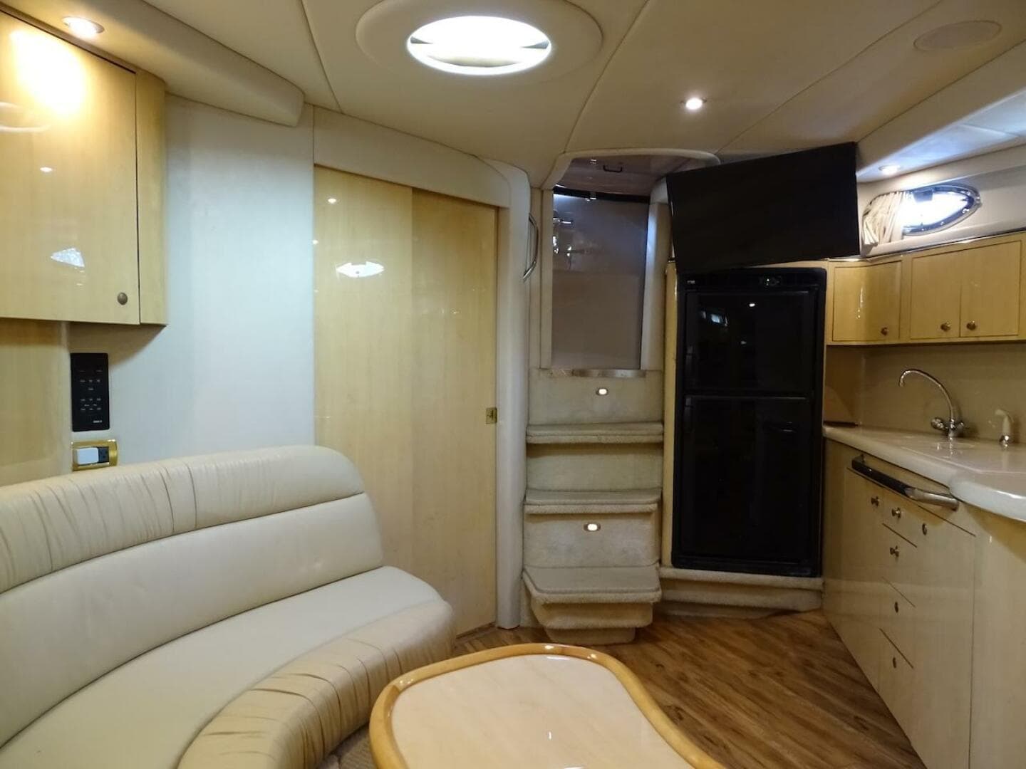 Luxurious interior of 2001 Sea Ray 410 Sundancer yacht with modern amenities.
