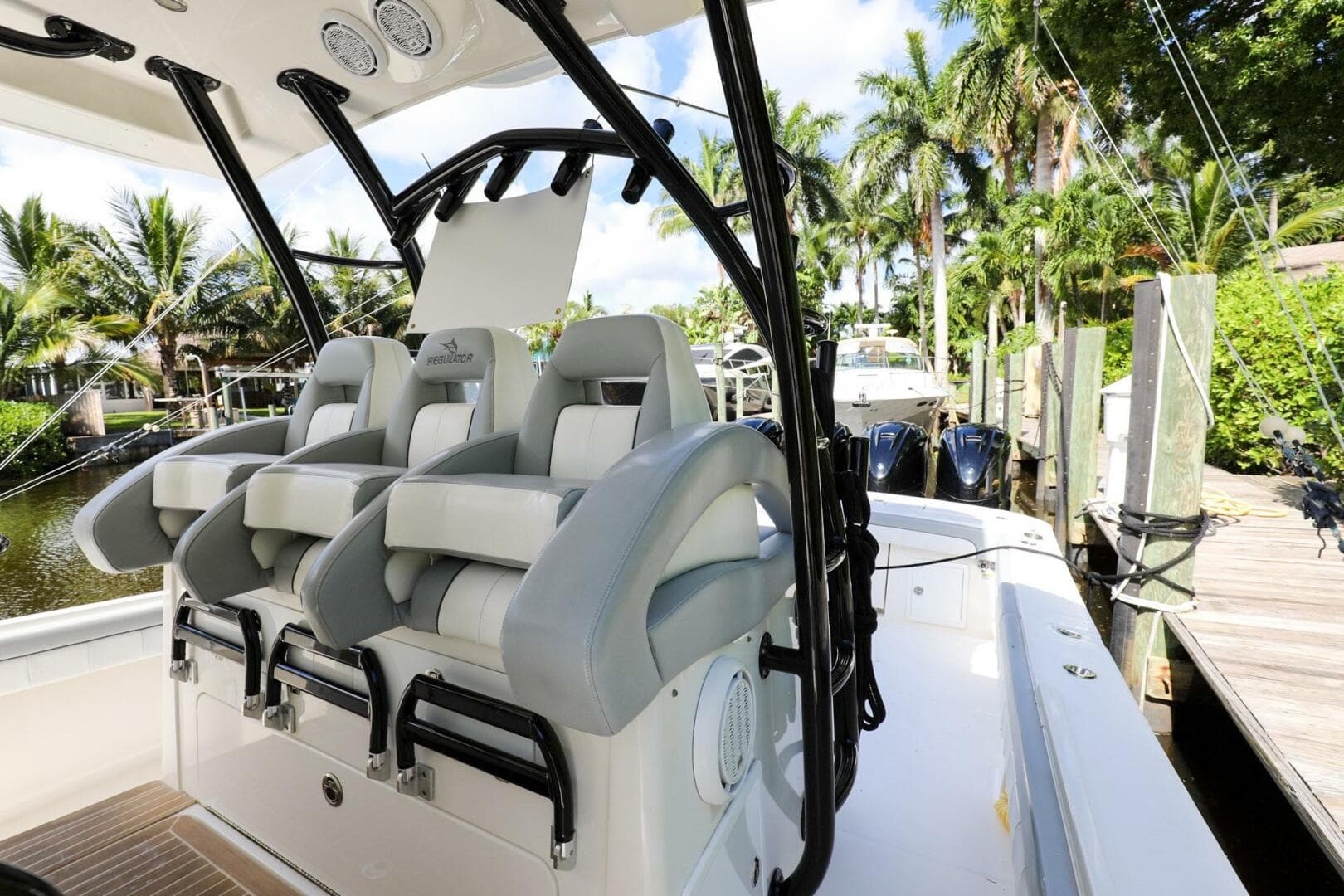 2020 Regulator 41 boat with luxurious seating and modern design at a dock.