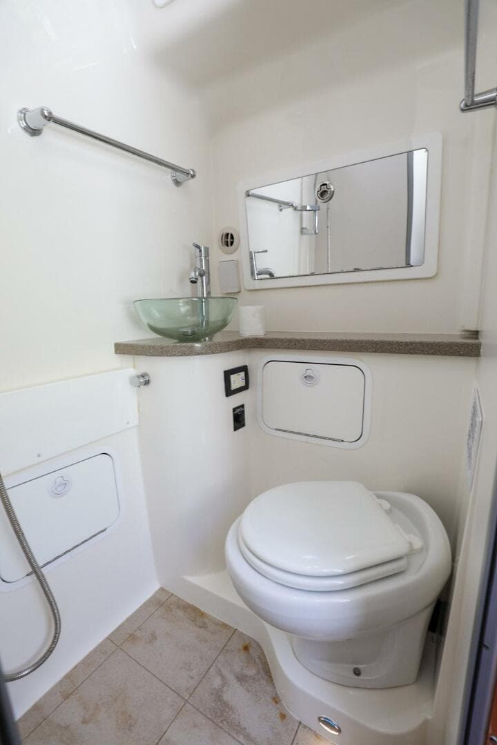 2020 Regulator 41 boat bathroom with modern fixtures and glass sink.