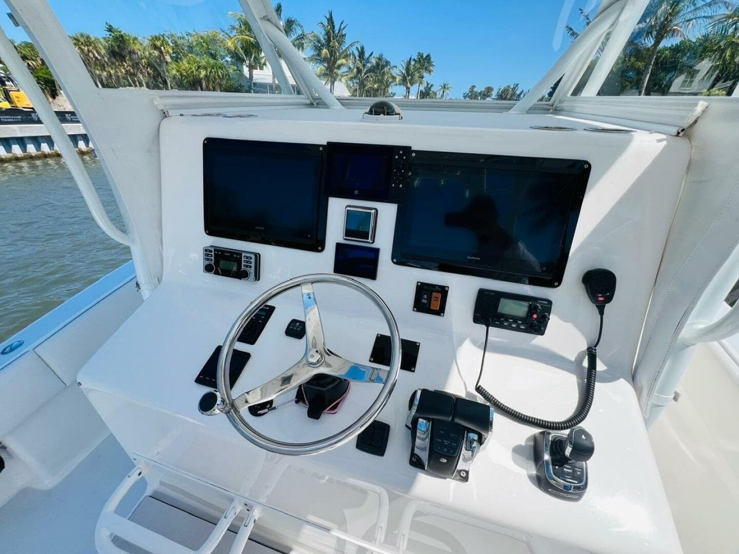 2015 Billfish 39 Custom CC helm with dual screens and navigation controls.