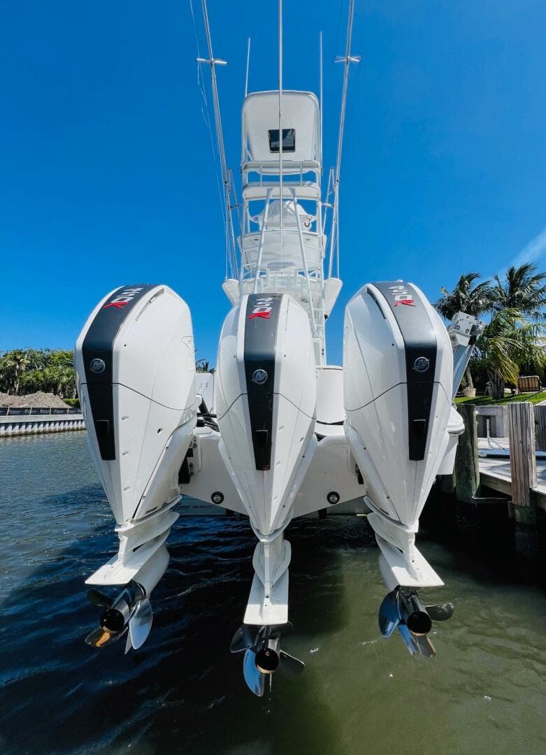 2015 Billfish 39 Custom CC boat with triple outboard engines docked.