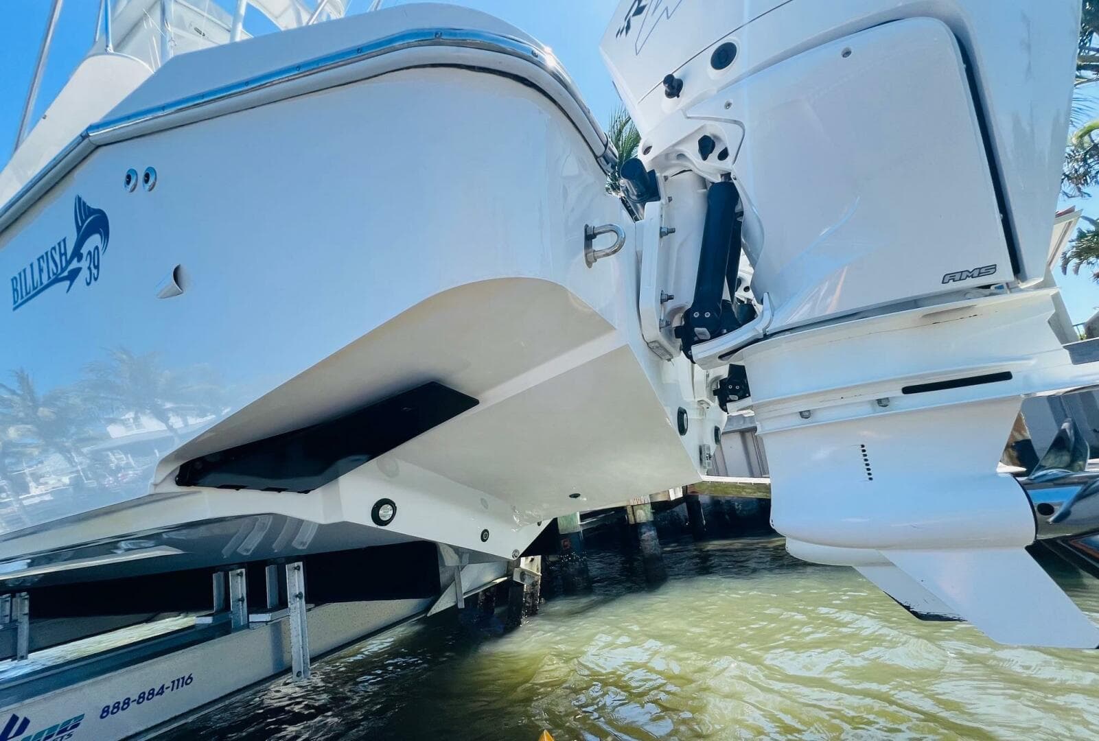 2015 Billfish 39 Custom CC boat on a lift, showing the hull and outboard motor.