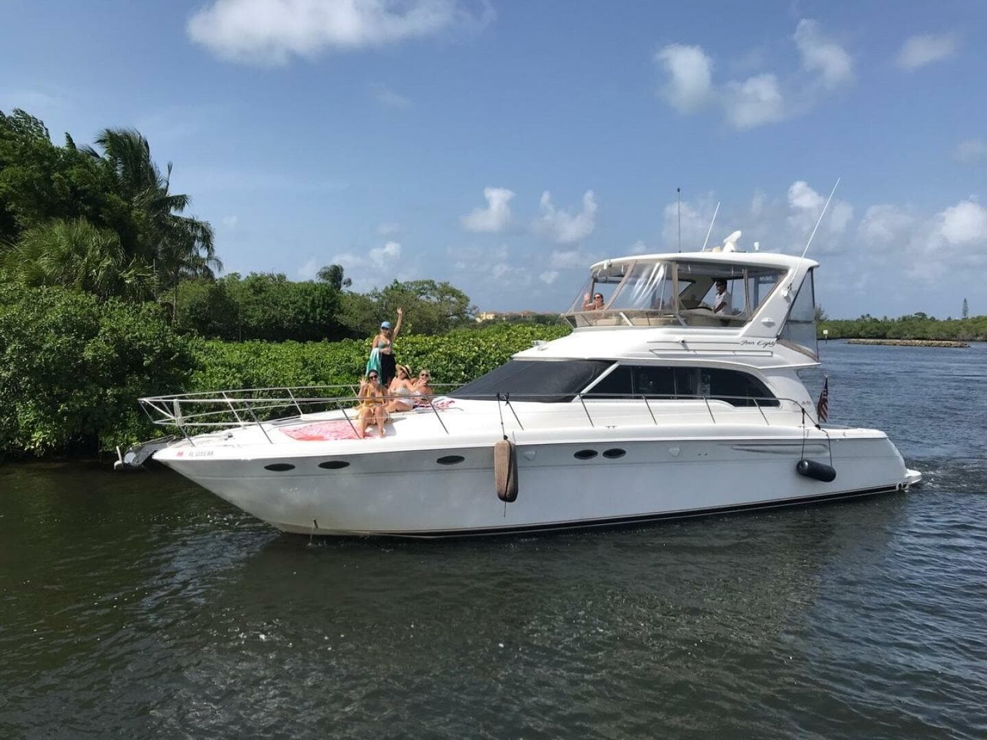 1998 Sea Ray 480 Sedan Bridge yacht cruising on a sunny day.