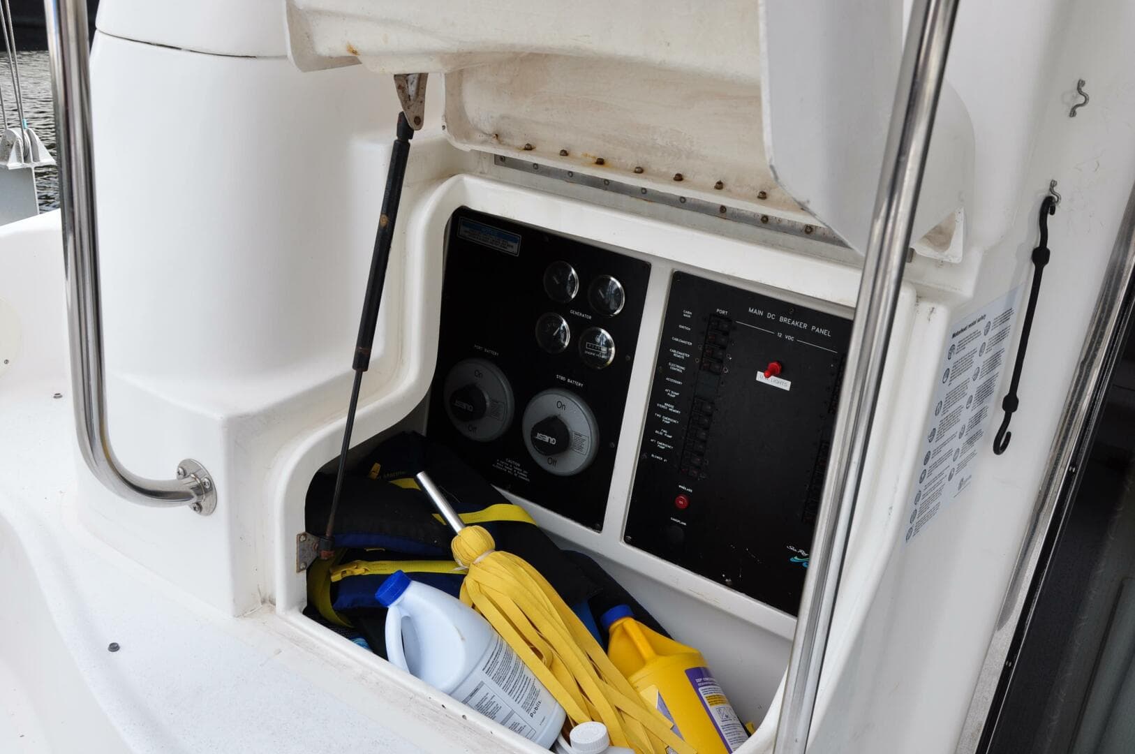 Control panel and storage compartment on a 1998 Sea Ray 480 Sedan Bridge boat.