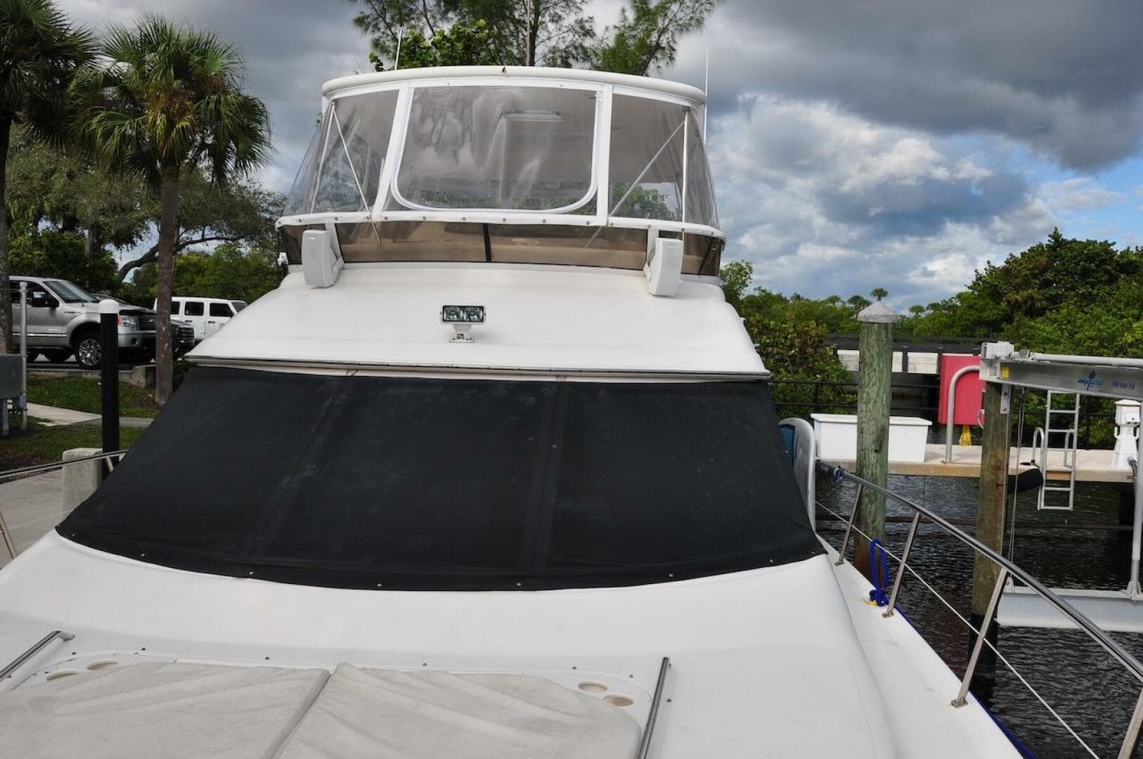 1998 Sea Ray 480 Sedan Bridge yacht docked at a marina.