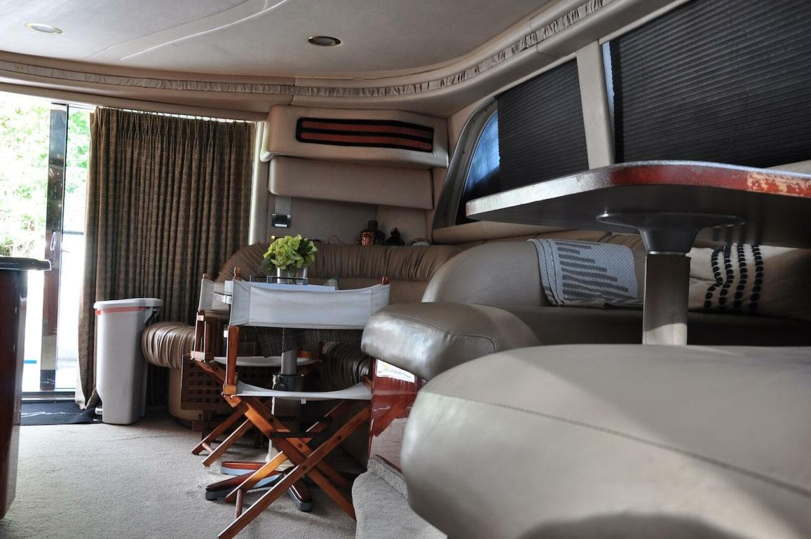 Interior of 1998 Sea Ray 480 Sedan Bridge yacht with seating and dining area.