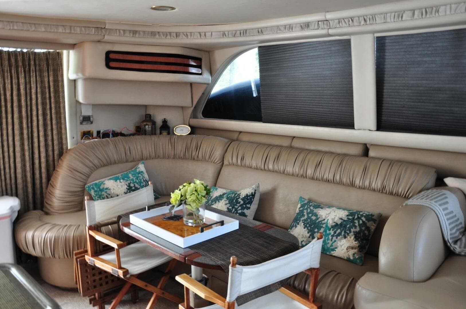 Luxurious interior of 1998 Sea Ray 480 Sedan Bridge yacht with plush seating.
