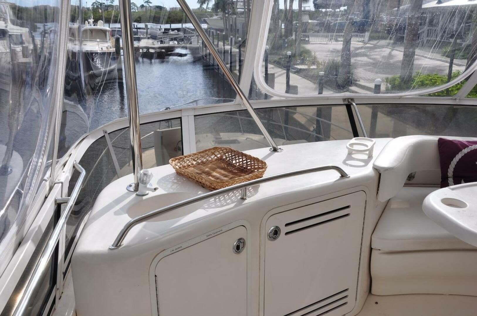 1998 Sea Ray 480 Sedan Bridge yacht interior with marina view.