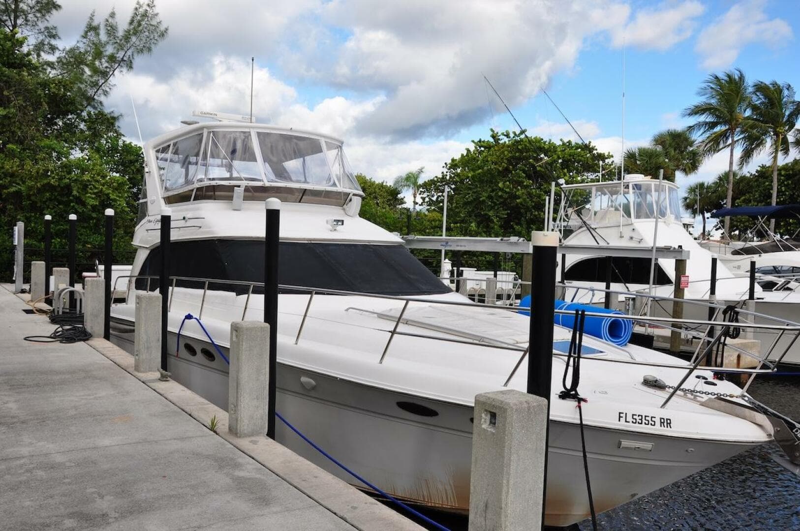 1998 Sea Ray 480 Sedan Bridge yacht docked at marina.