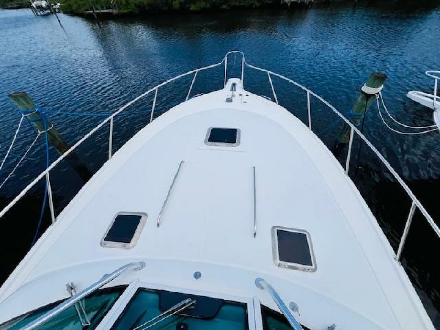 Tiara Yachts 3800 Open 2003 model, view from bow on calm water.