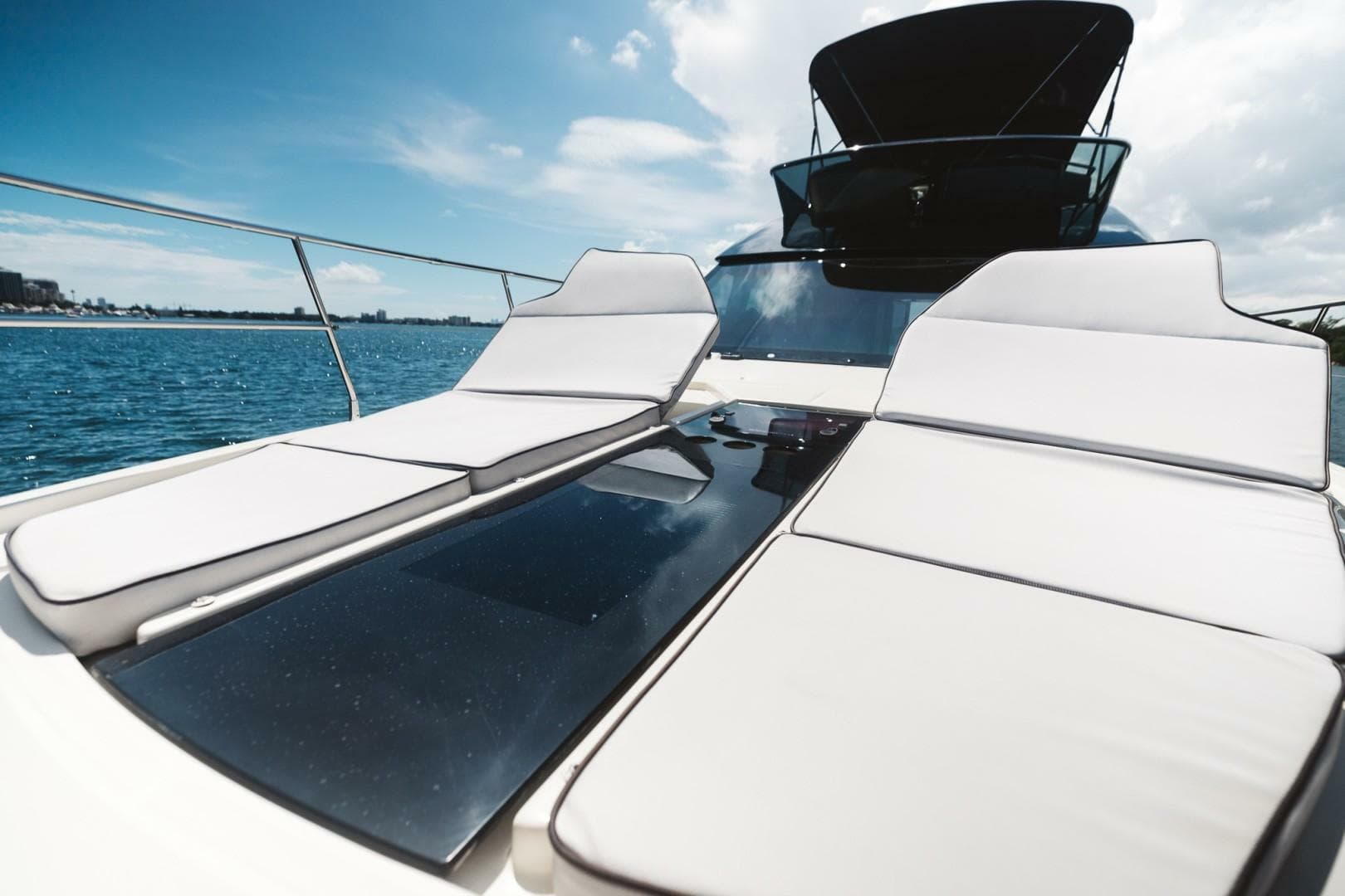 Luxurious 2015 Beneteau Monte Carlo 5 yacht with sun loungers on deck.