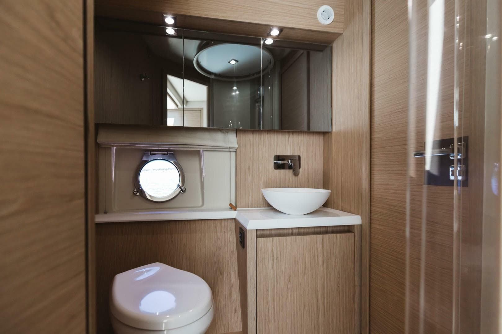 Luxurious bathroom in 2015 Beneteau Monte Carlo 5 yacht with modern fixtures.