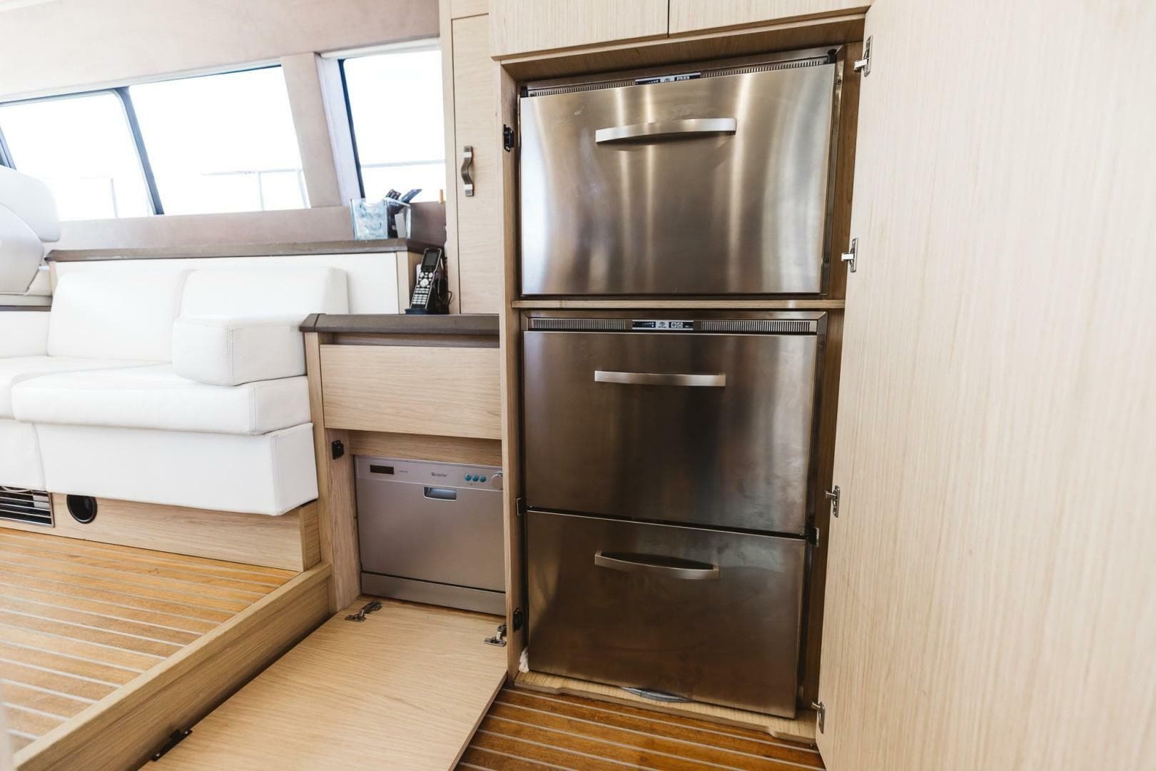 Luxury yacht interior with stainless steel appliances, Beneteau Monte Carlo 5, 2015 model.