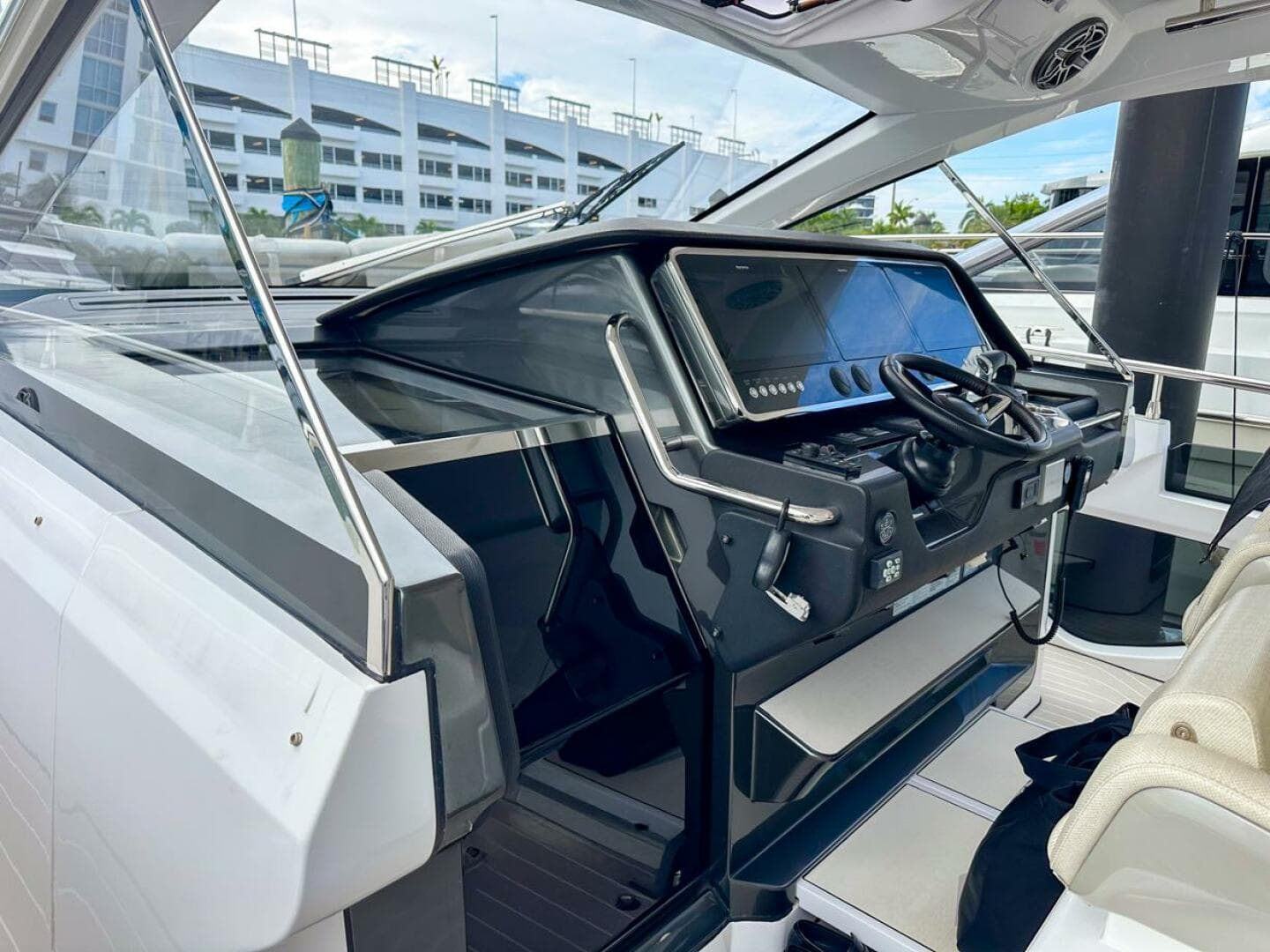 2023 Azimut Verve 47 yacht cockpit with modern steering and navigation controls.