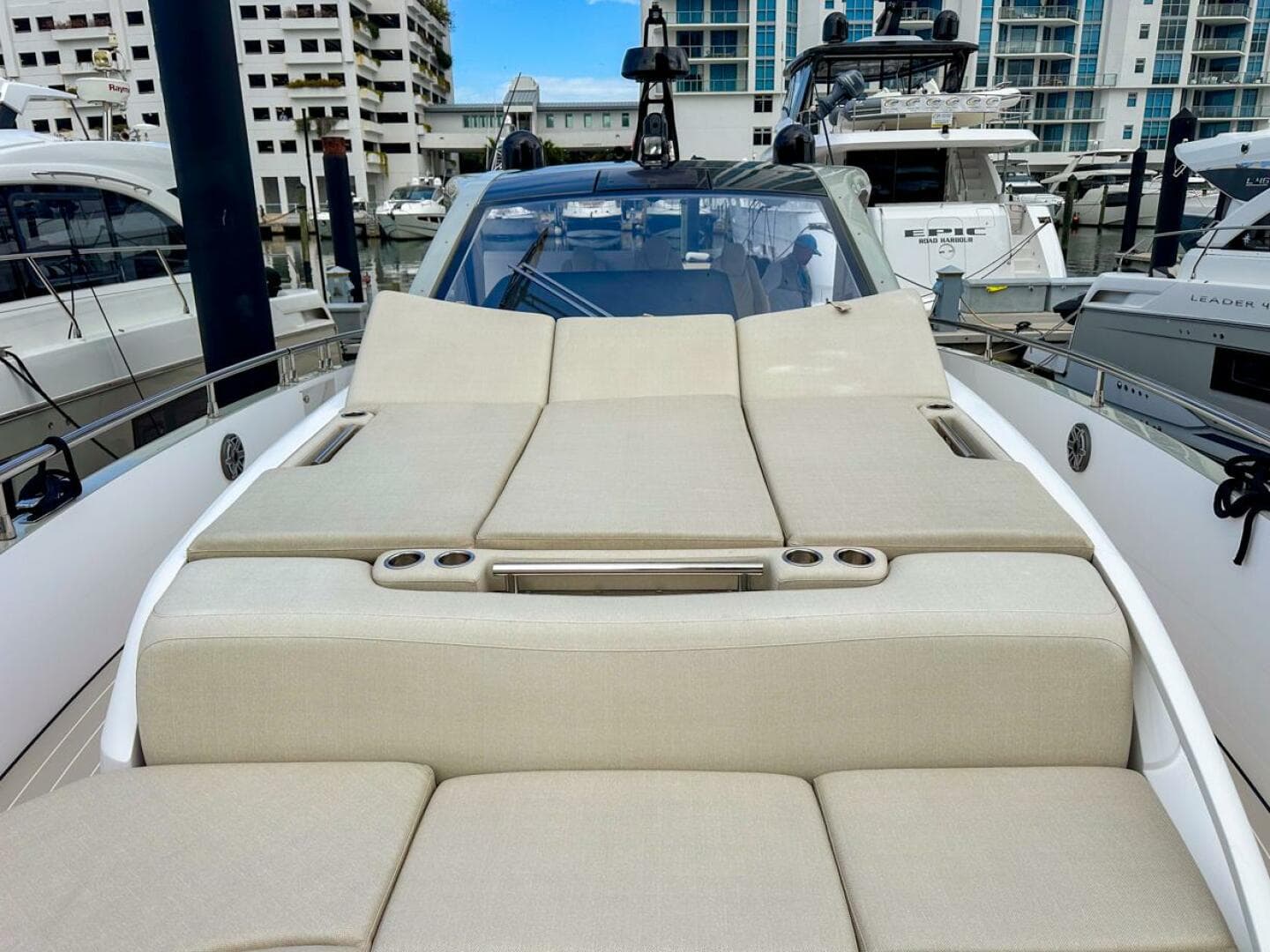2023 Azimut Verve 47 yacht with luxurious sunbathing deck in marina setting.