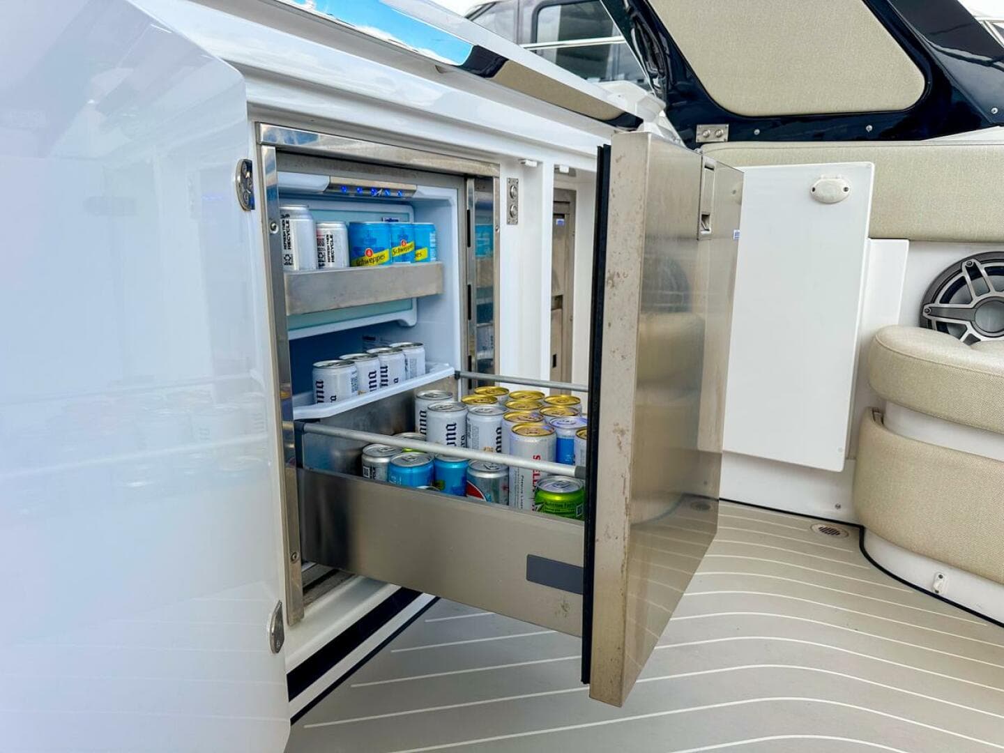 2023 Azimut Verve 47 yacht with open fridge stocked with beverages.