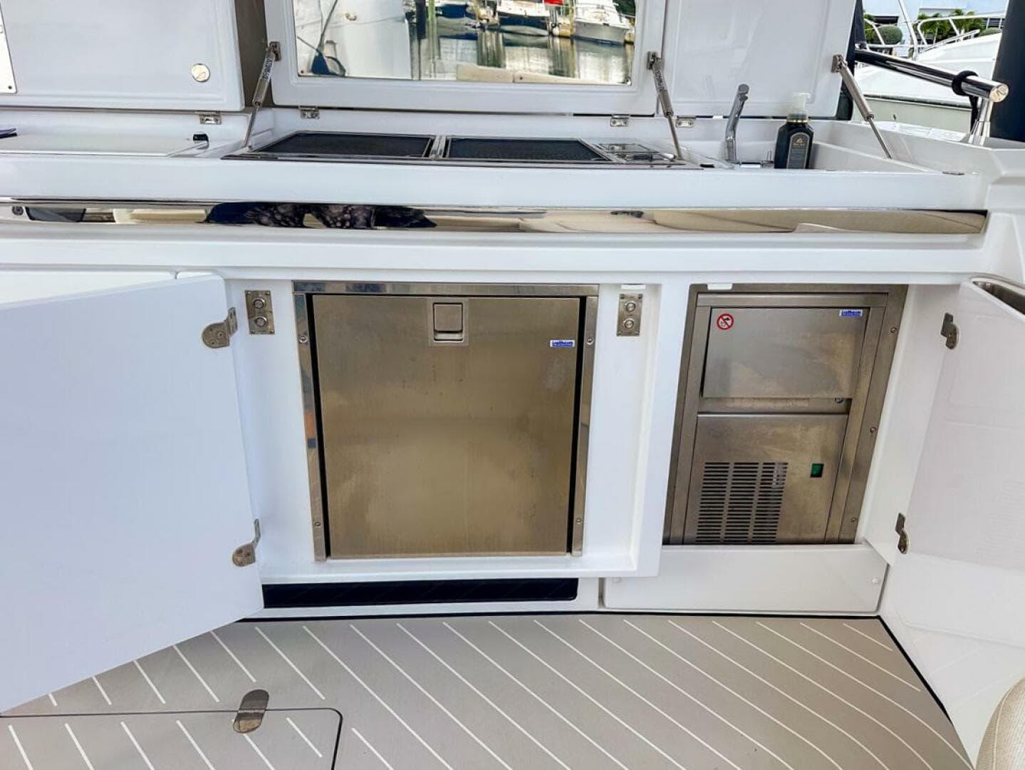 2023 Azimut Verve 47 yacht kitchen area with stainless steel appliances and sleek design.