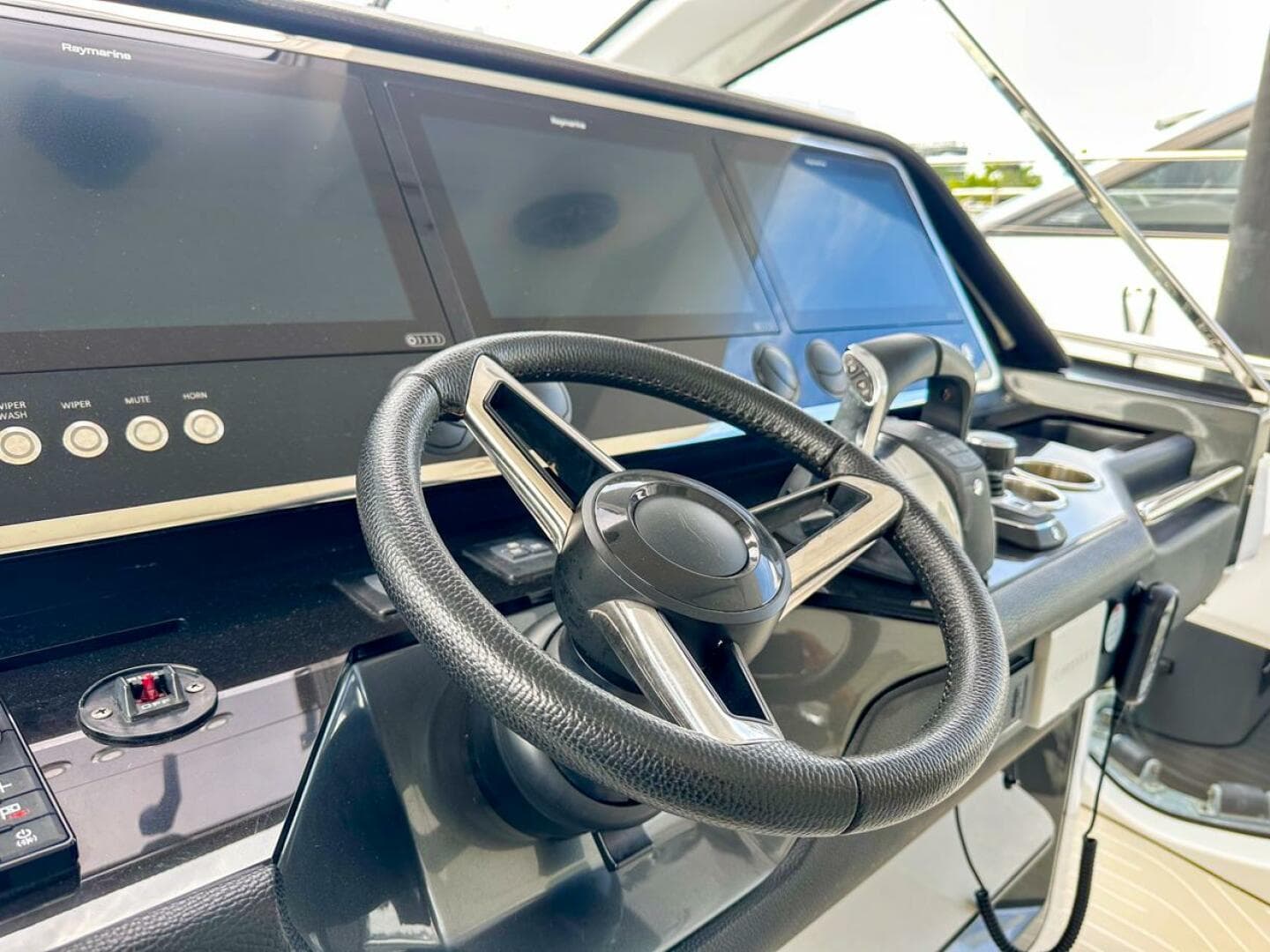 2023 Azimut Verve 47 yacht helm with modern steering and navigation displays.