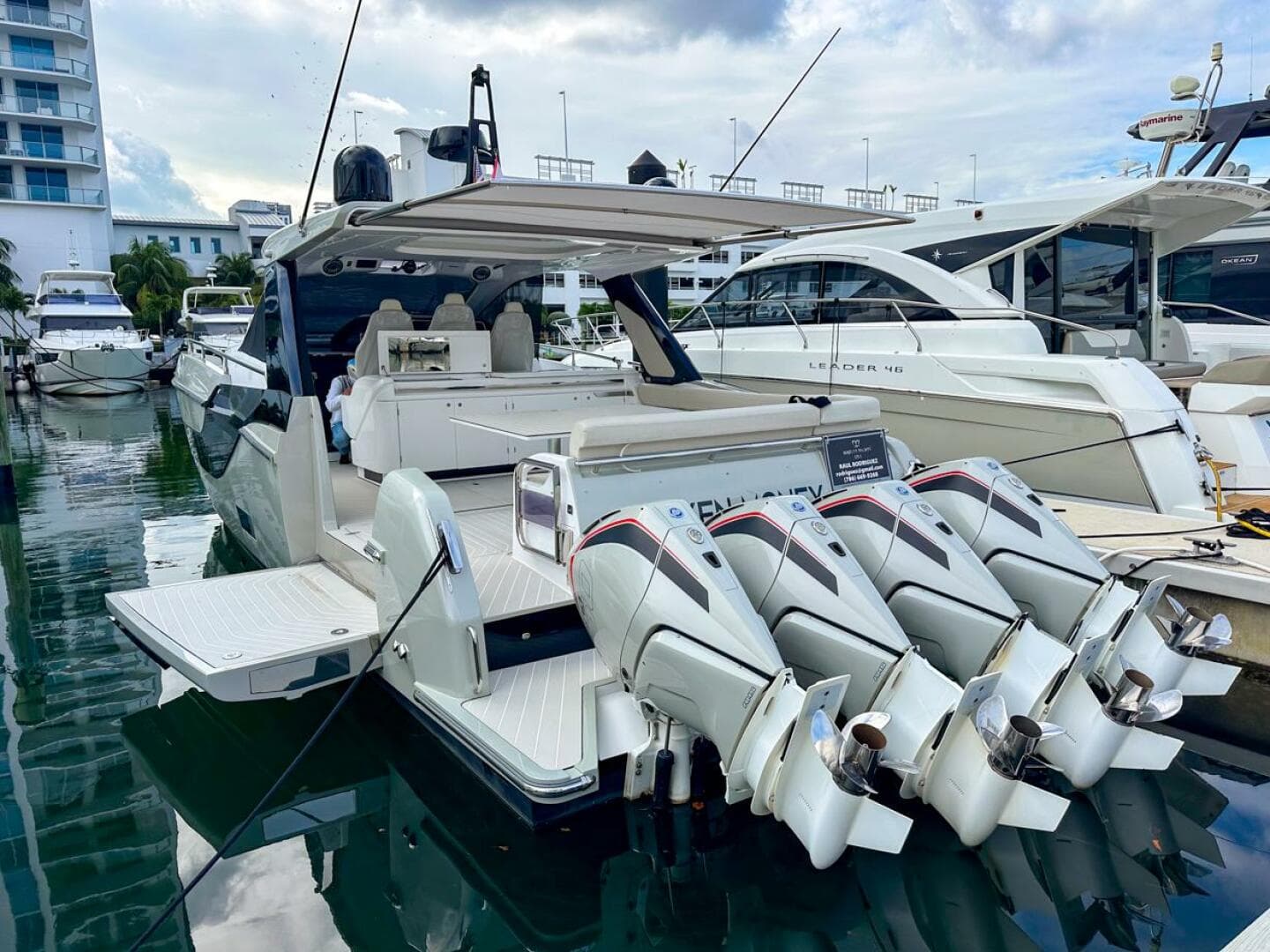 2023 Azimut Verve 47 yacht docked with four powerful outboard engines.