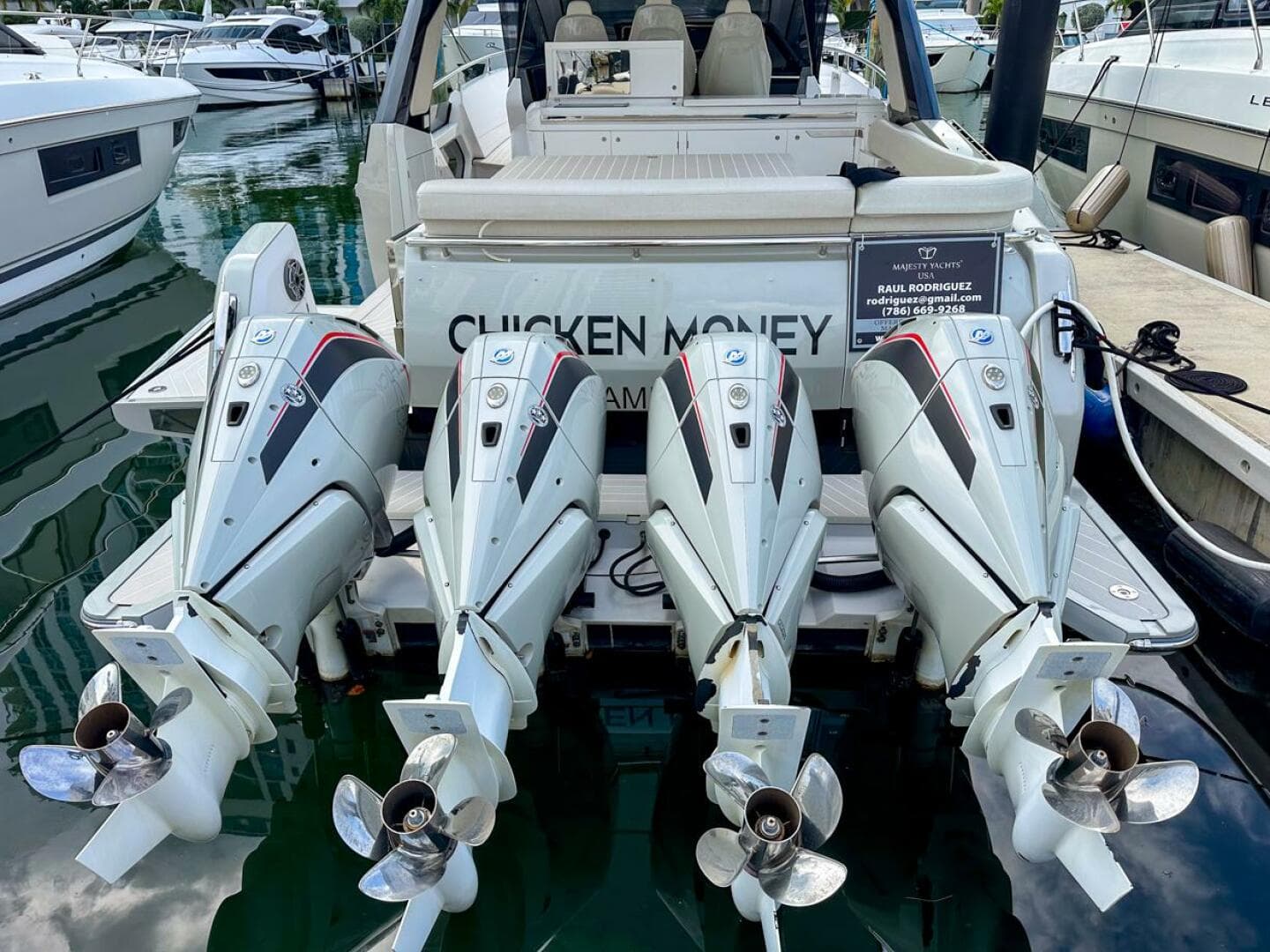 2023 Azimut Verve 47 with four powerful outboard engines docked at a marina.