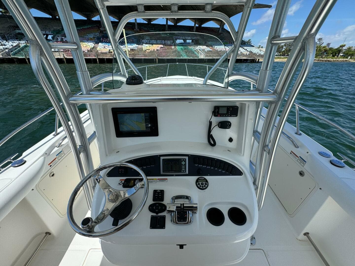 2008 Boston Whaler 320 Outrage boat helm with navigation equipment and controls.