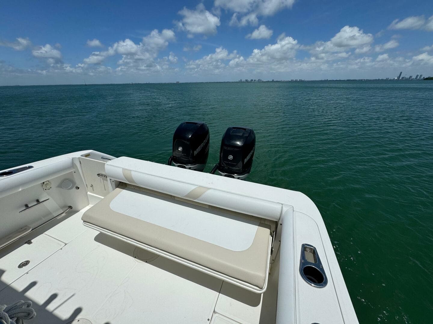 2008 Boston Whaler 320 Outrage boat with twin outboard motors on open water.