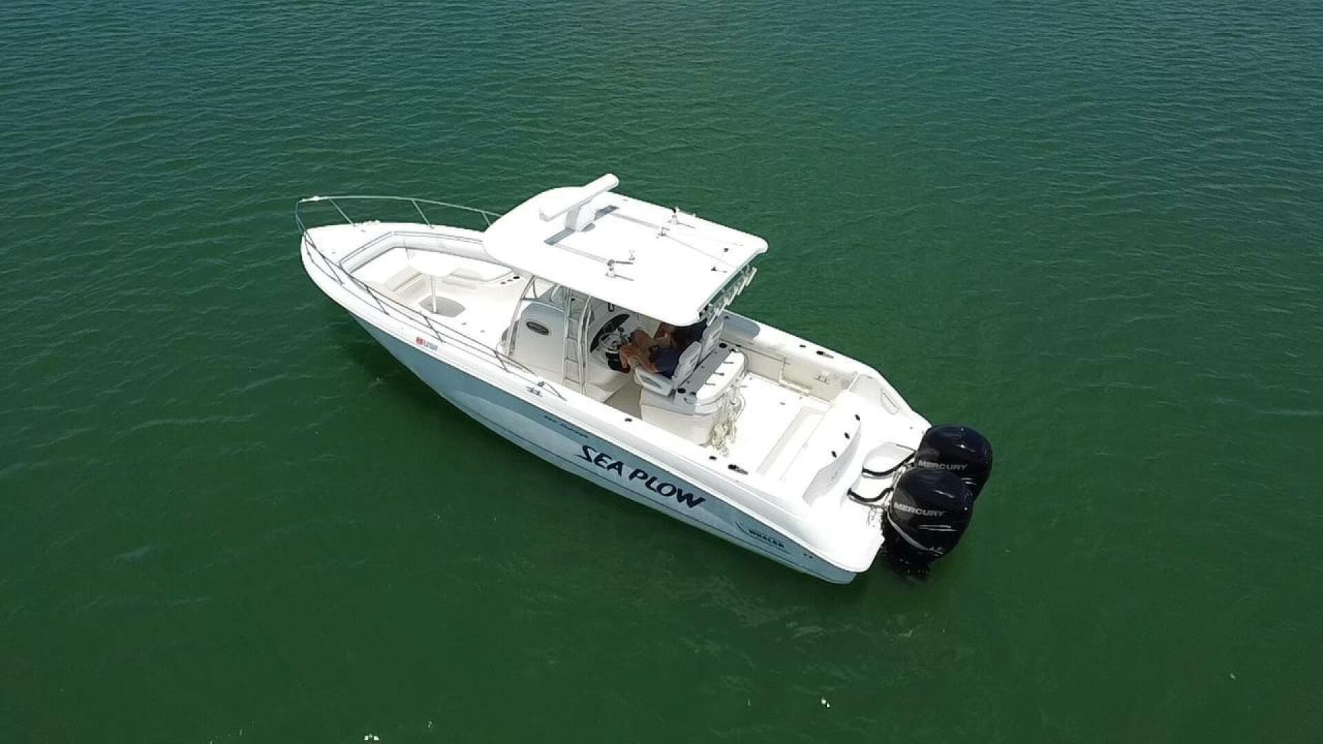 2008 Boston Whaler 320 Outrage boat on calm water.