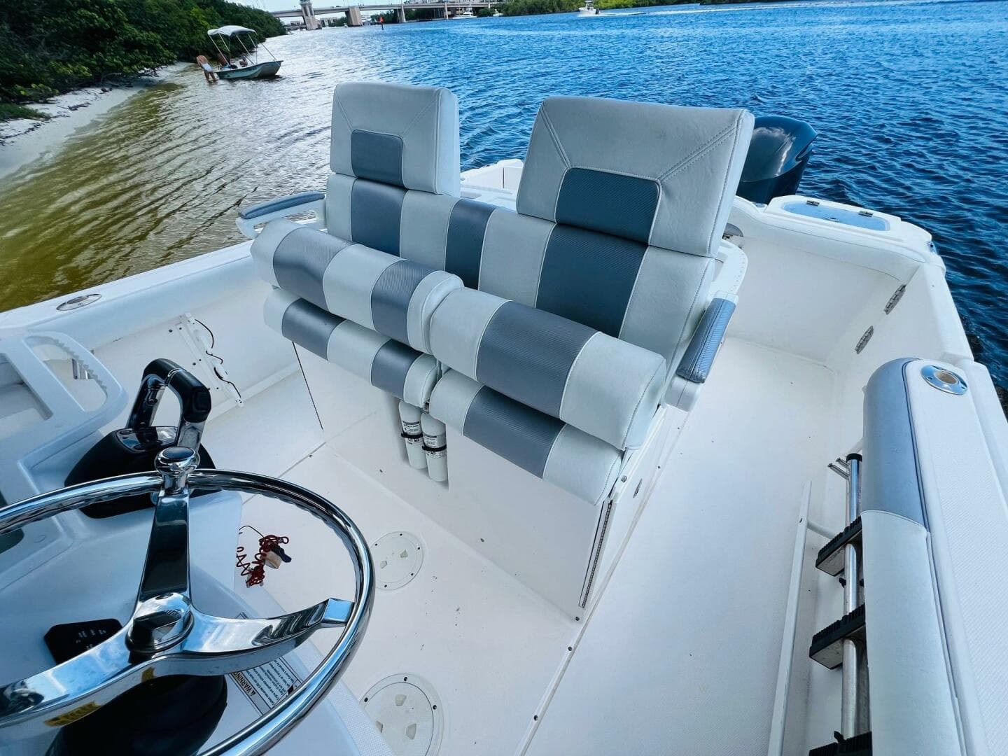2012 Everglades 295 Center Console boat interior with dual seats and steering wheel.
