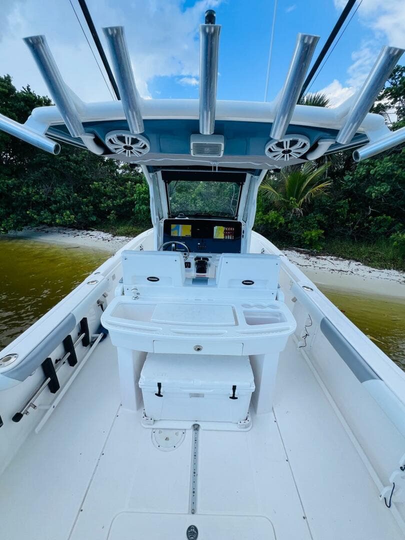 2012 Everglades 295 Center Console boat interior with fishing rod holders and navigation equipment.