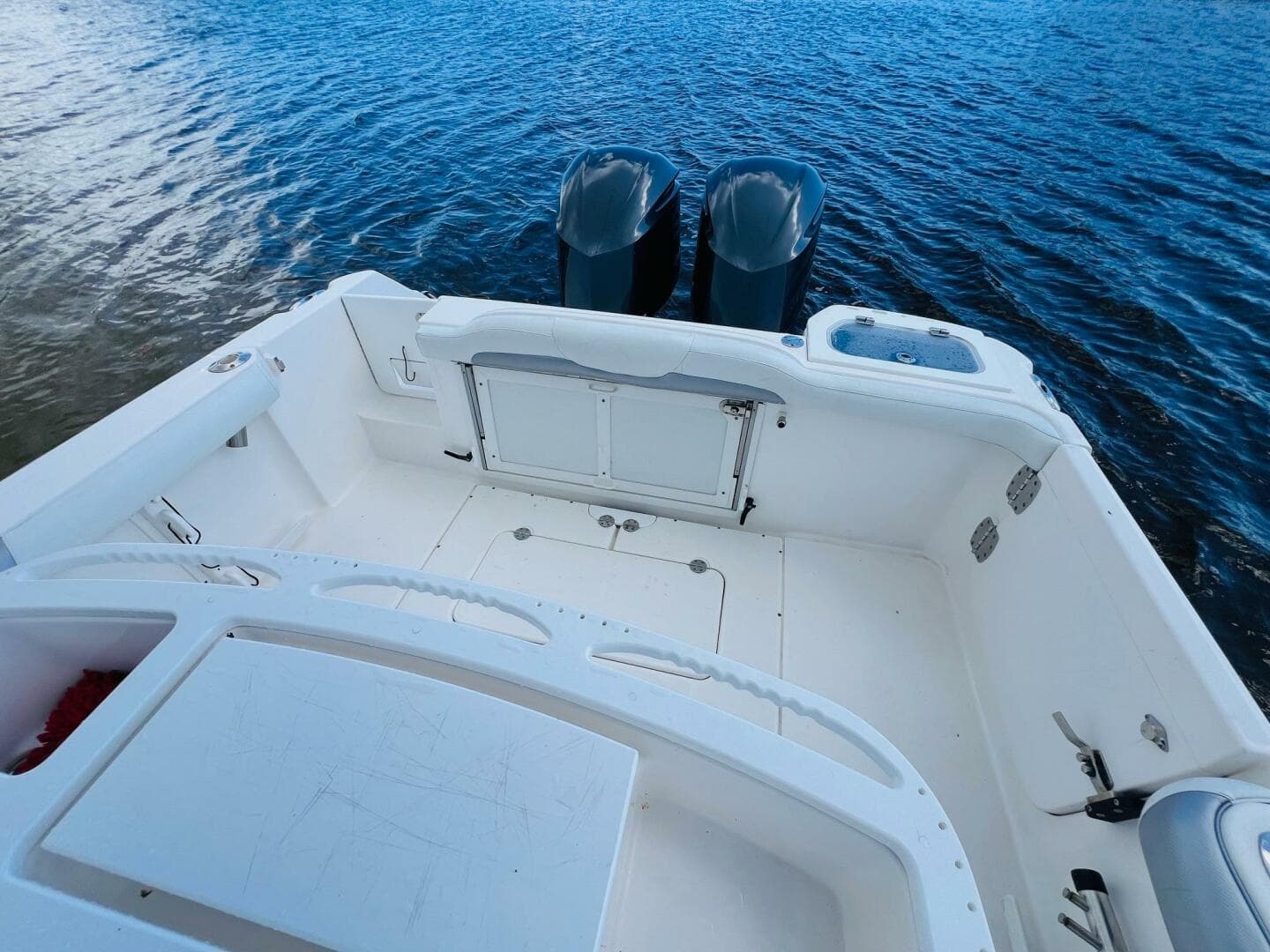2012 Everglades 295 Center Console boat with dual engines on calm water.