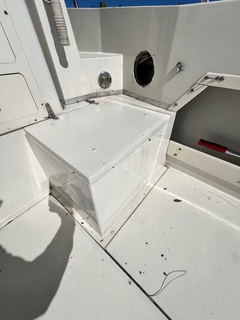 1988 Grady-White 25 SAILFISH boat interior, white seating area, clean and well-maintained.