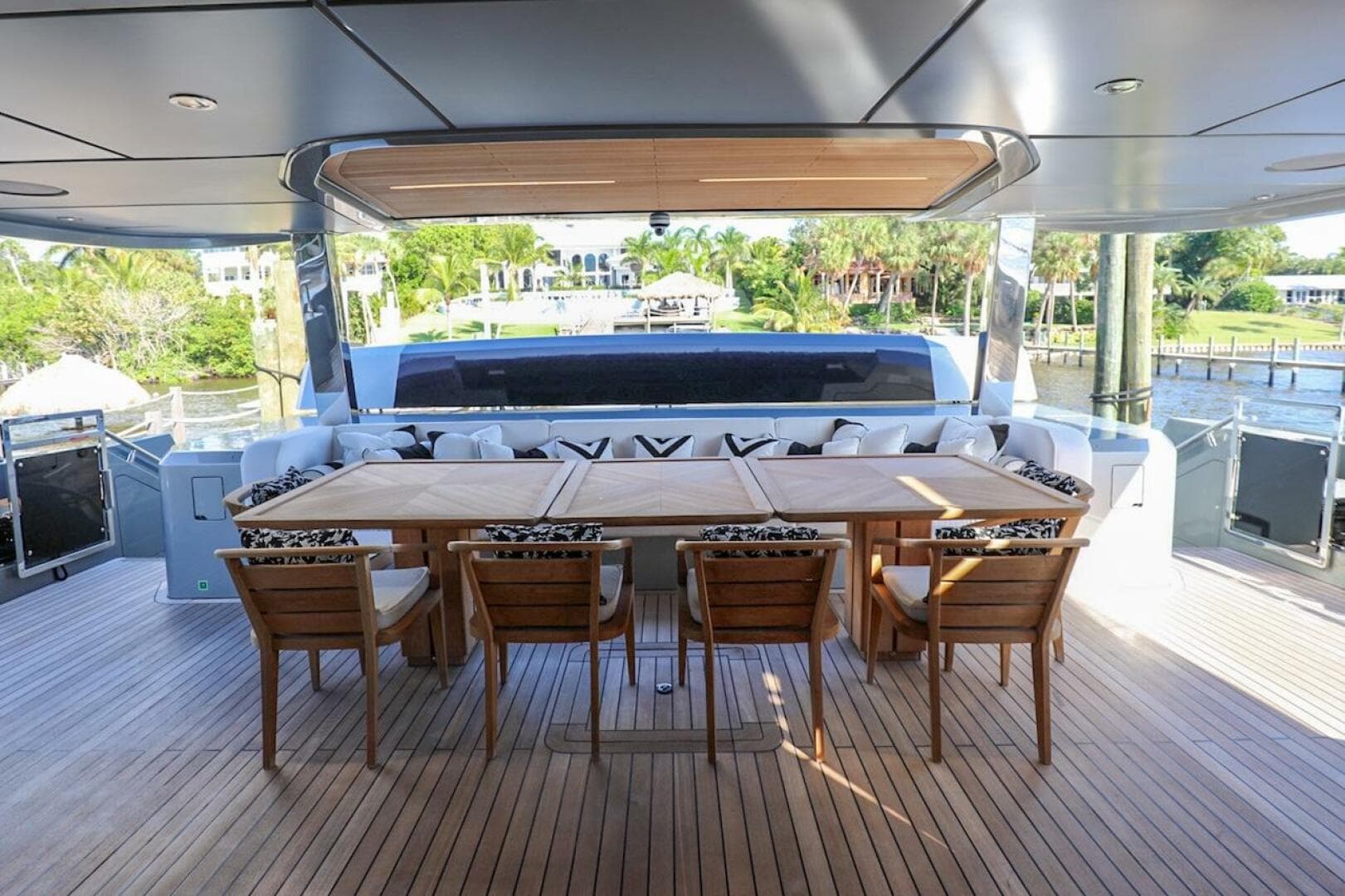 Luxurious 2025 Majesty 120 yacht deck with elegant dining area and scenic views.