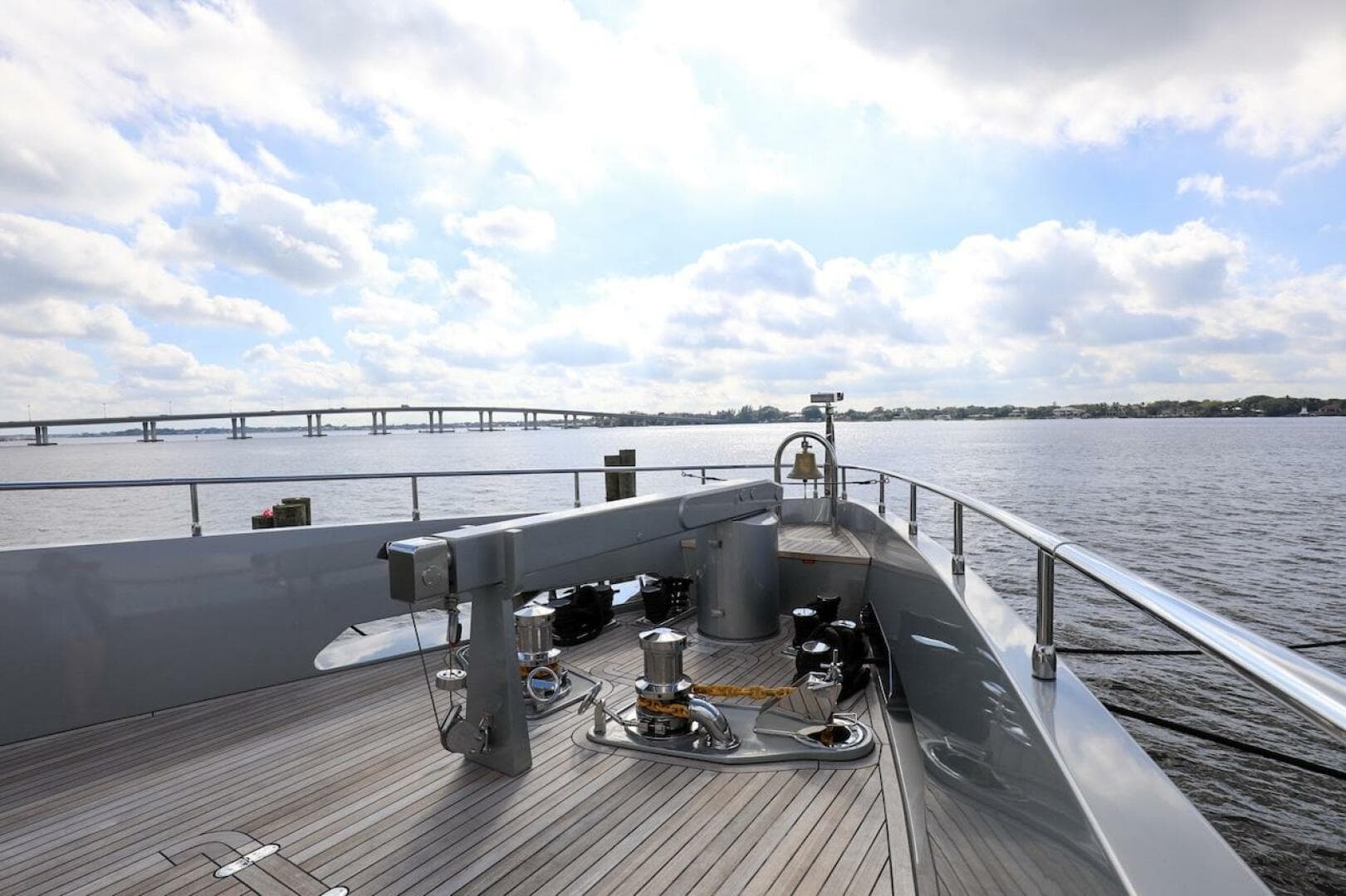 Majesty 120 yacht deck, 2025 model, cruising on a sunny day with bridge view.