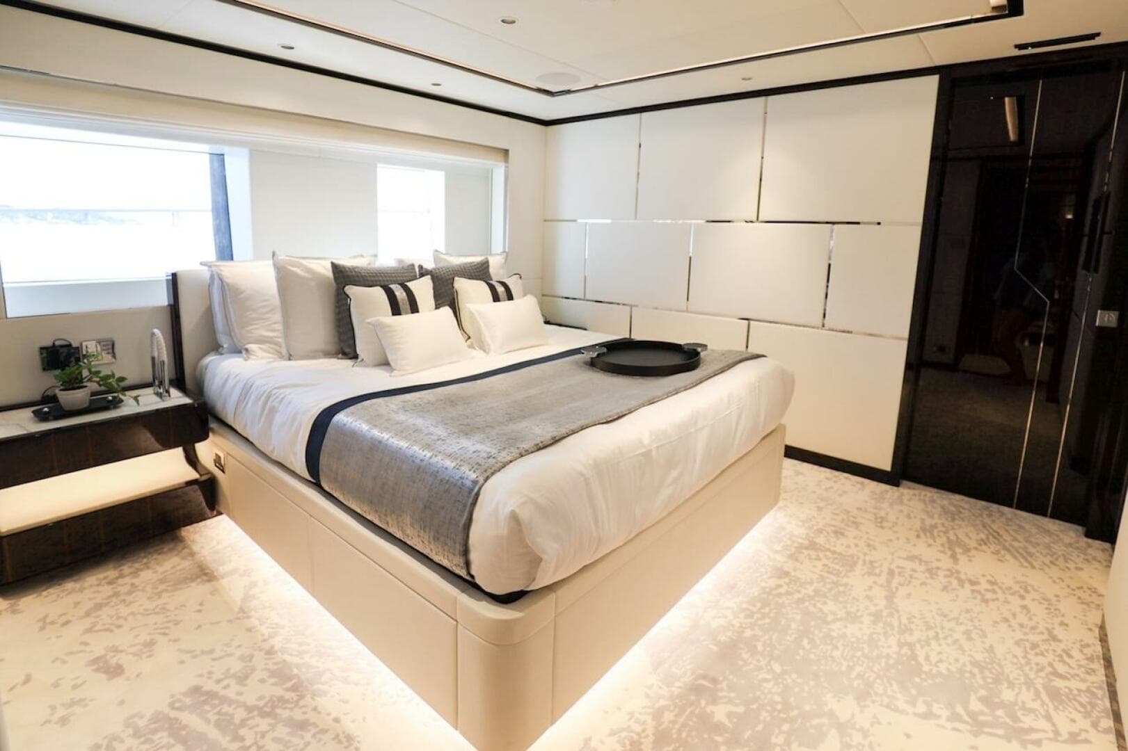 Luxurious bedroom interior on 2025 Majesty 120 yacht, featuring modern design and elegant furnishings.