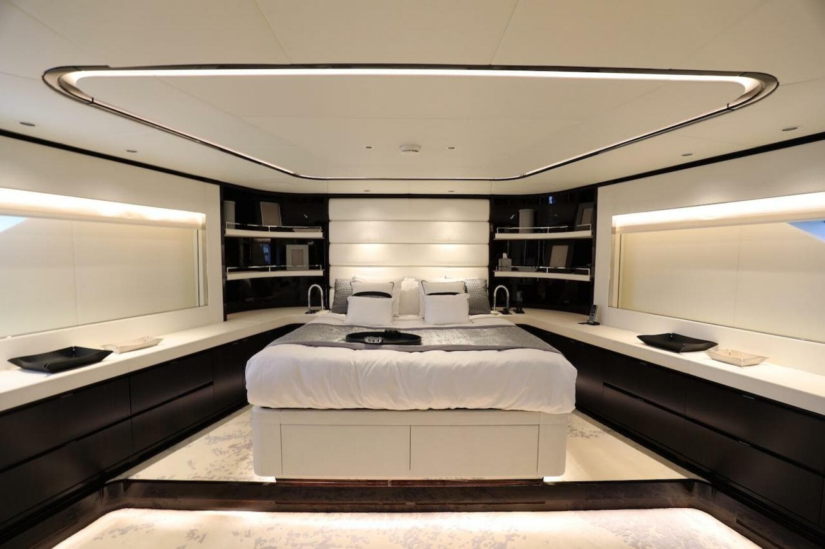Luxurious bedroom interior on 2025 Majesty 120 yacht, featuring modern design and ambient lighting.