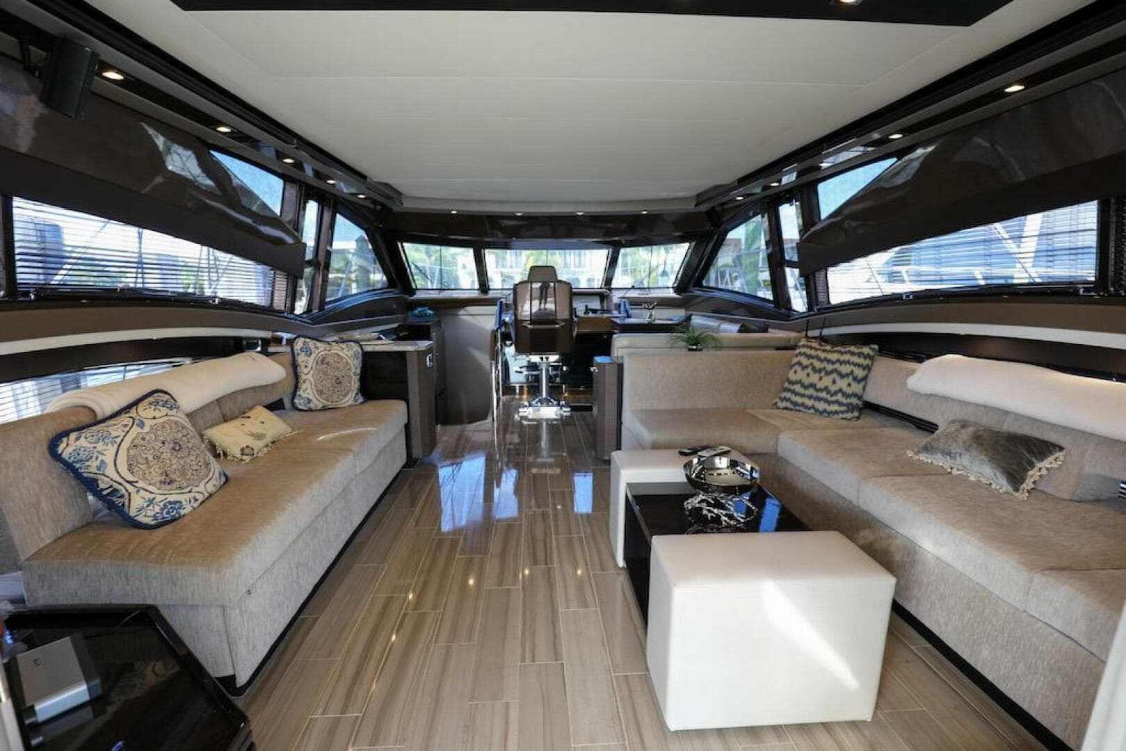 Luxurious interior of 2016 Marquis 660 Sport Yacht with elegant seating and modern decor.
