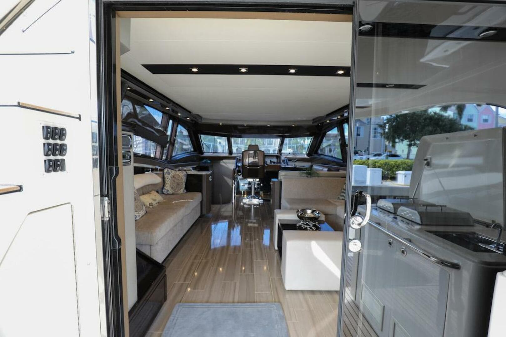 Interior view of 2016 Marquis 660 Sport Yacht, featuring luxurious seating and modern design.