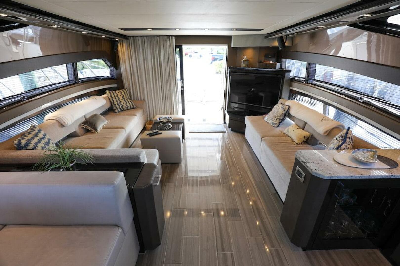 Luxurious interior of a 2016 Marquis 660 Sport Yacht with elegant seating and modern decor.