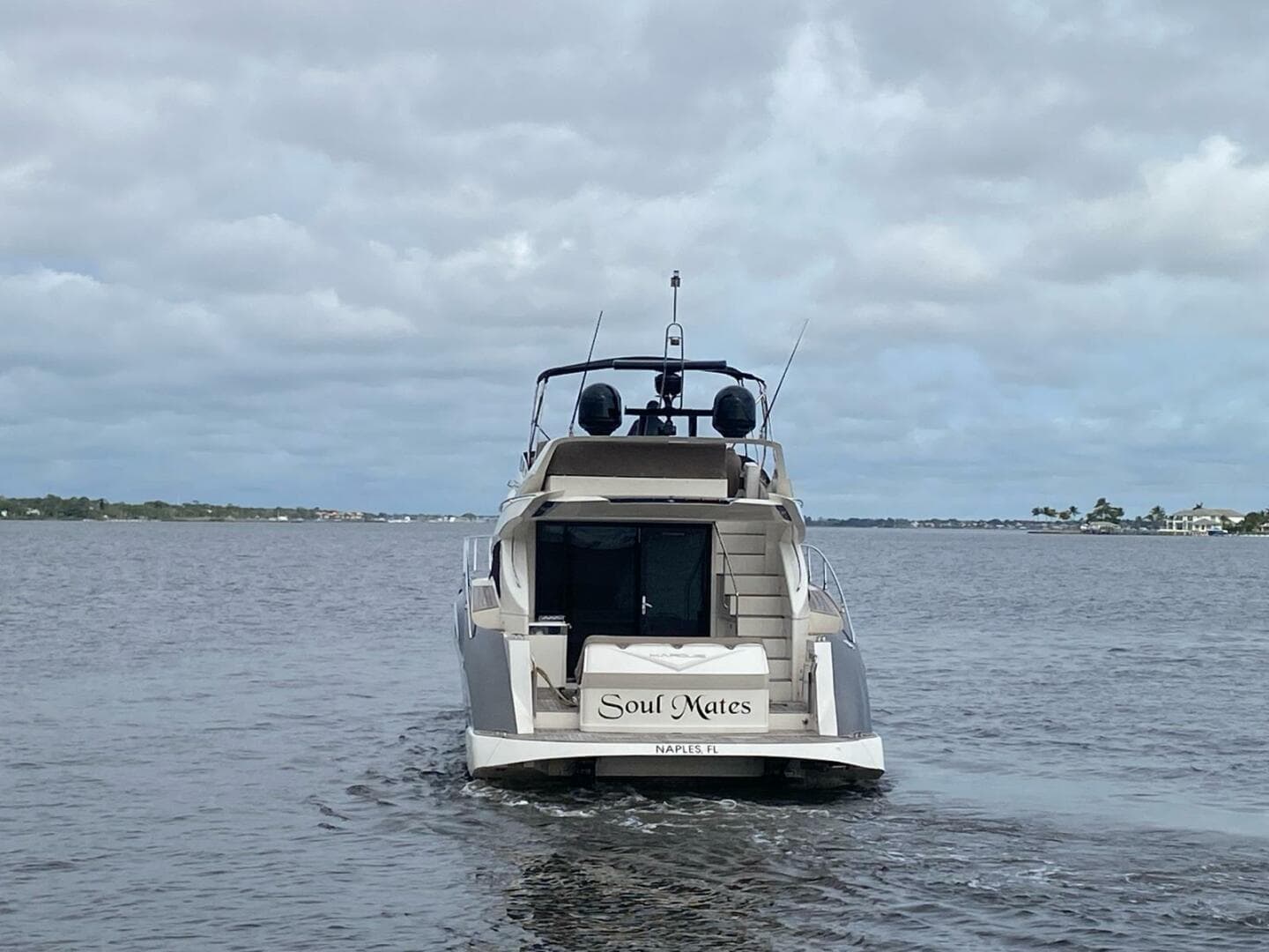 2017 Marquis 500 Sport Yacht Soul Mates cruising on a cloudy day.