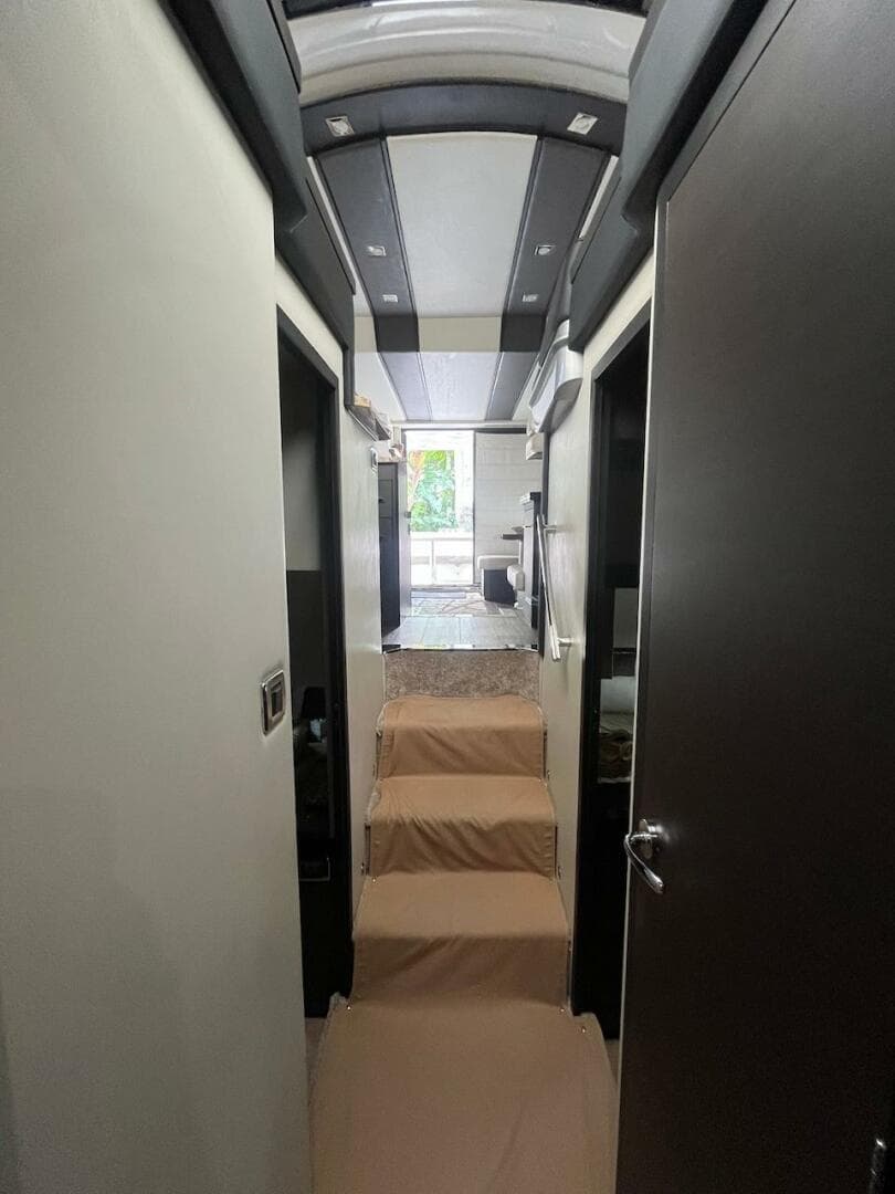 Interior hallway of a 2017 Marquis 500 Sport Yacht with modern design.