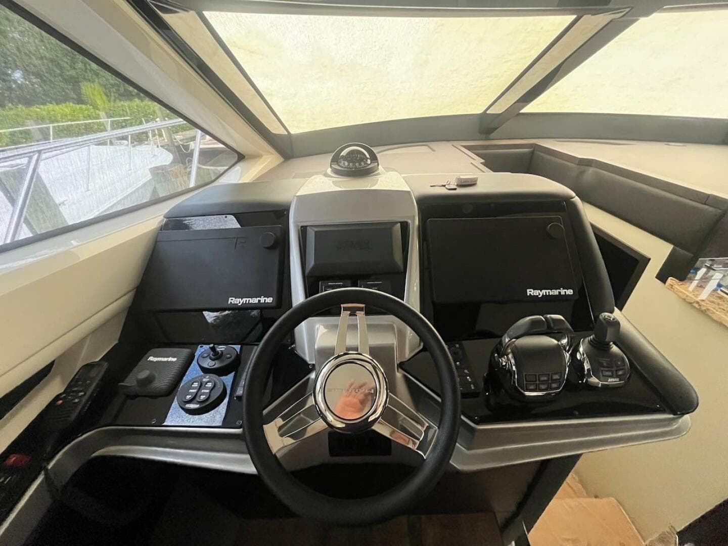 Helm of 2017 Marquis 500 Sport Yacht with Raymarine electronics.
