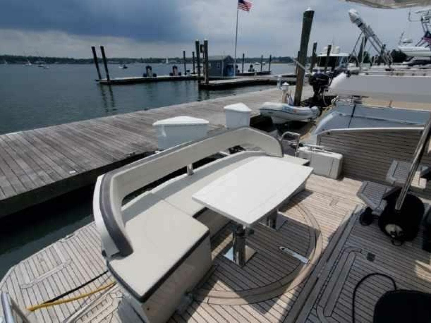 Galeon 500 Fly 2020 yacht docked, featuring a stylish outdoor seating area.