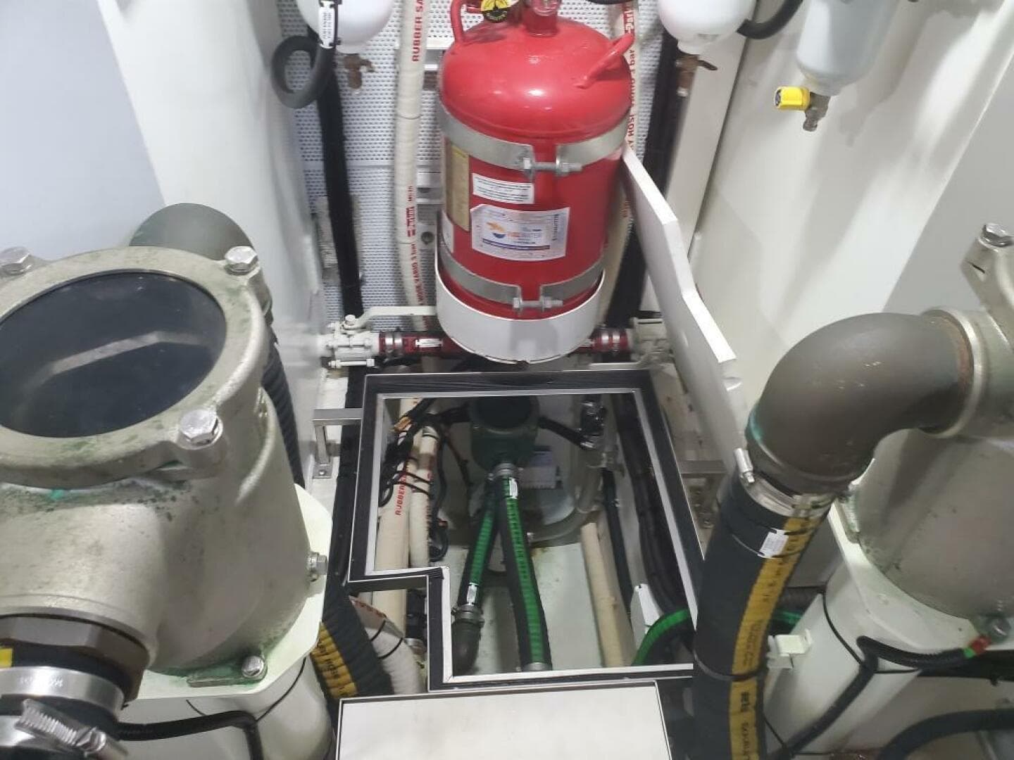 Engine room of a 2020 Galeon 500 Fly yacht with fire extinguisher.